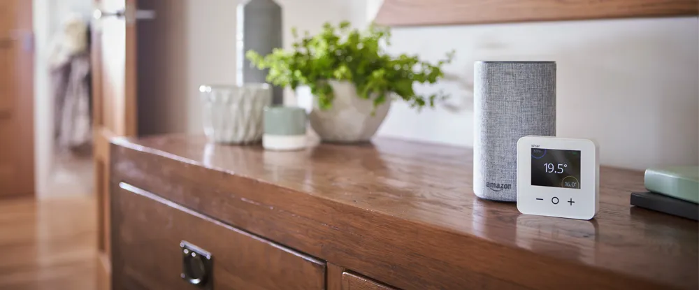 Thermostat and Amazon Echo device on sideboard