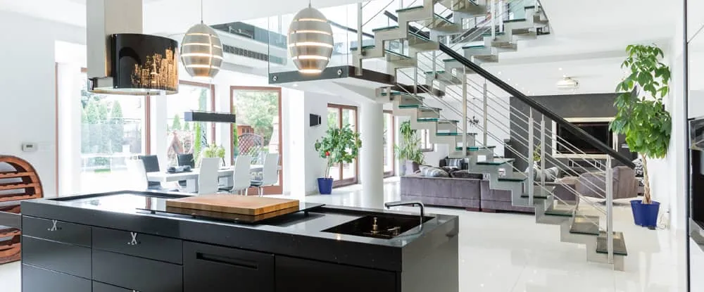 A large open plan kitchen, dining room and lounge with stairs