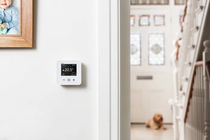wiser thermostat on a wall