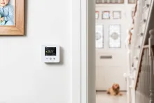 wiser thermostat on a wall