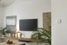 The Wiser Temperature and Humidity Sensor fitted to a wall in a living room