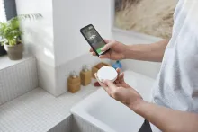 Homeowner pairs the Wiser Water Leakage Sensor with the Wiser Home app