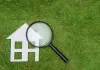 Home Energy Model explanation - Green turf with white house and magnifying glass