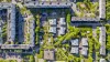 Top down view of modern social housing surrounded by trees