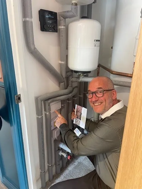 Martyn Bletso - Drayton Area Sales Manager for the South West, inspecting a Wiser Smart Heating Hub at a bunnyhomes new build property