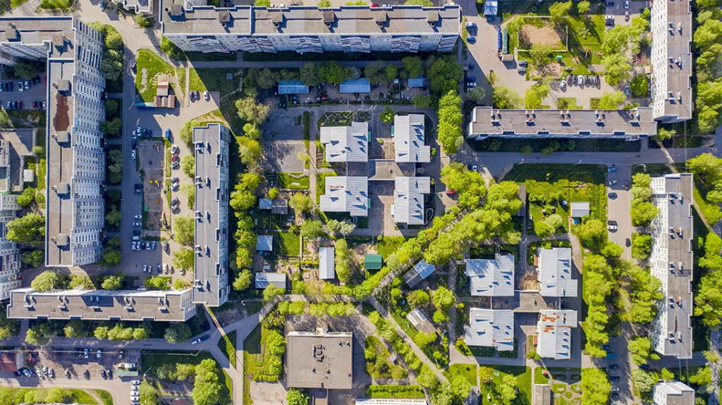 Top down view of modern social housing surrounded by trees