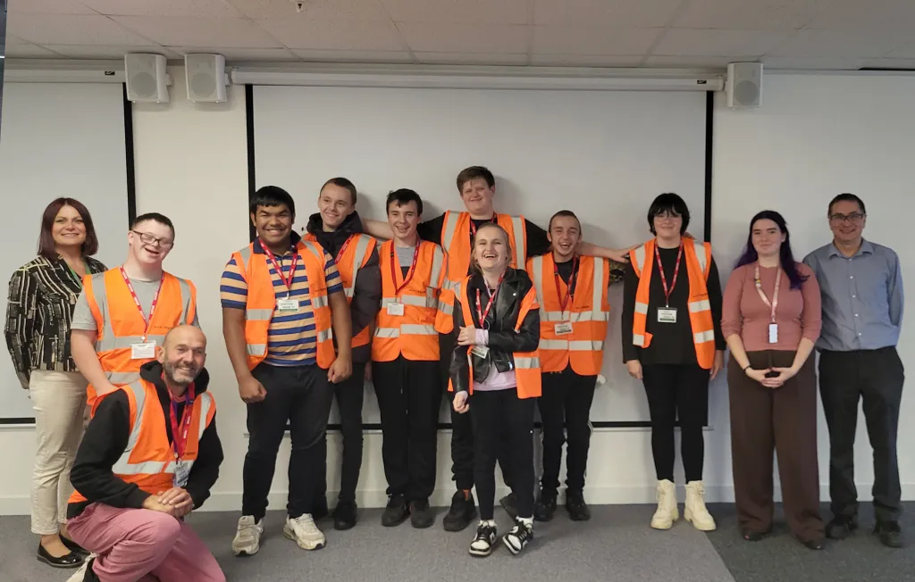 A group photo of cheerful students from a Plymouth school specialising in complex needs, taking part in STEM outreach activities at Drayton Controls in Plymouth