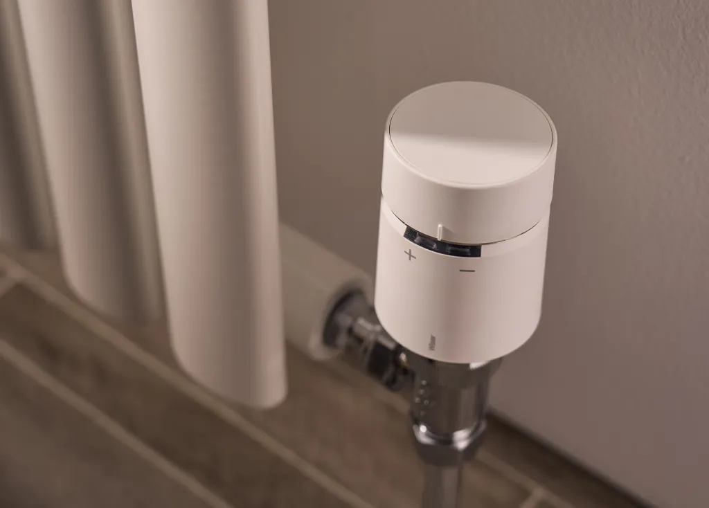 Wiser's smart radiator thermostat installed on a radiator valve